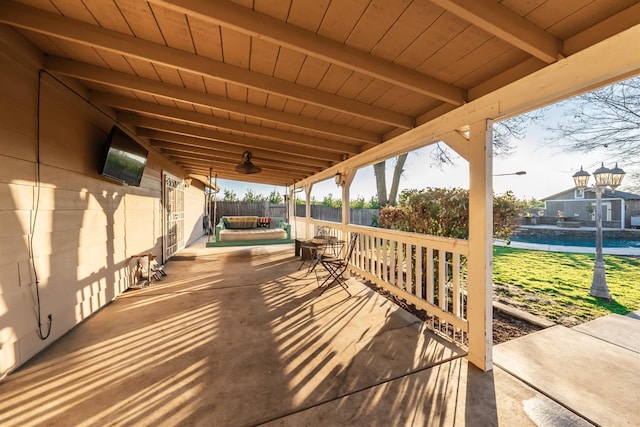 wooden deck with a patio area