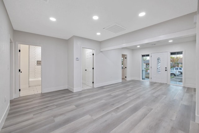 empty room with light hardwood / wood-style floors