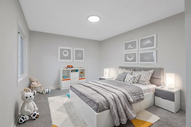 bedroom featuring light carpet