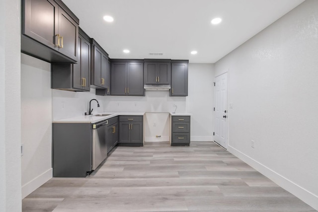 kitchen with dishwasher, light wood-type flooring, and sink