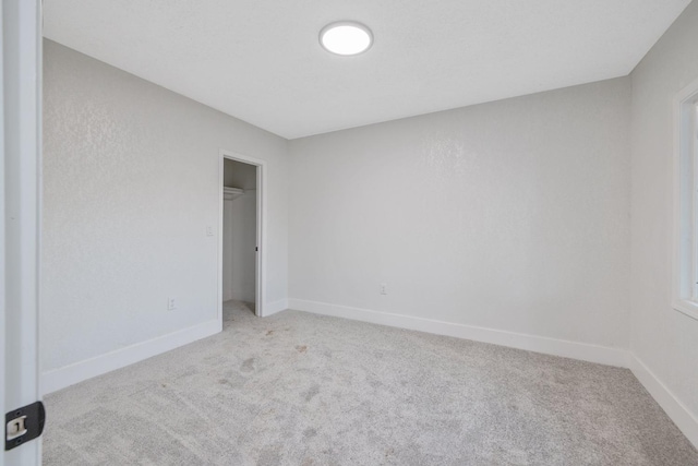 spare room with light carpet