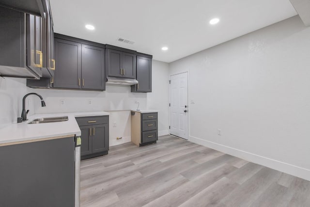 kitchen featuring sink and light hardwood / wood-style flooring