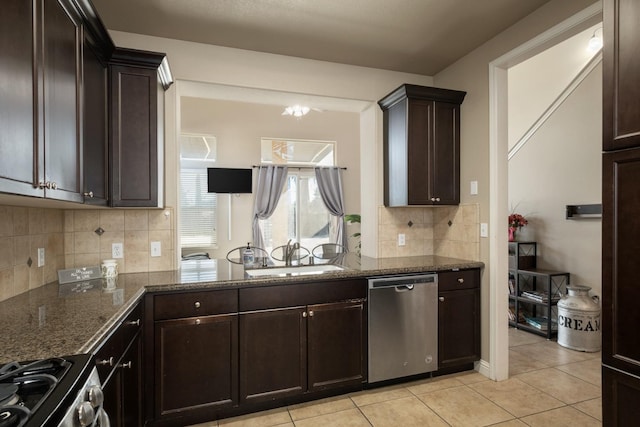 kitchen with dishwasher, stove, sink, light tile patterned floors, and dark brown cabinets