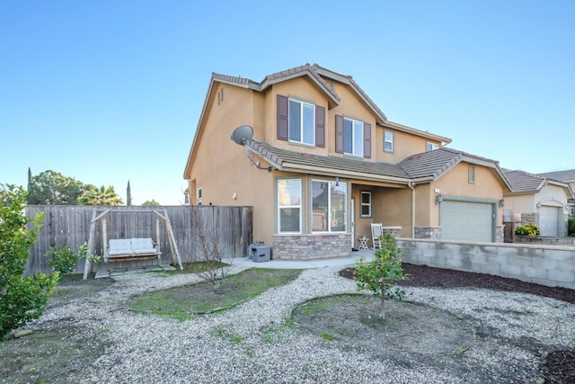 view of front of property featuring a garage