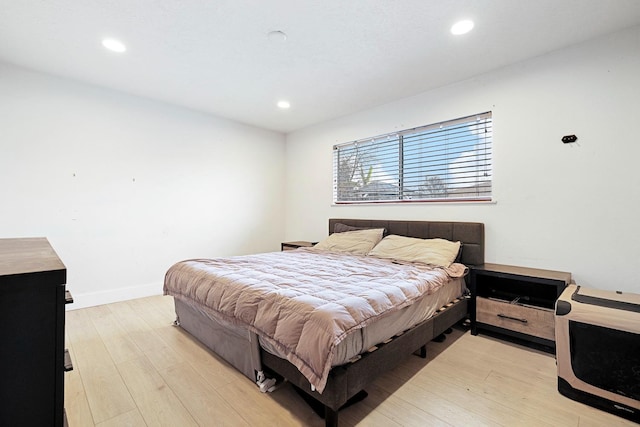 bedroom with light hardwood / wood-style flooring