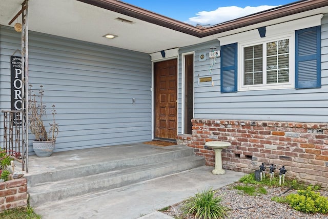 doorway to property with a porch