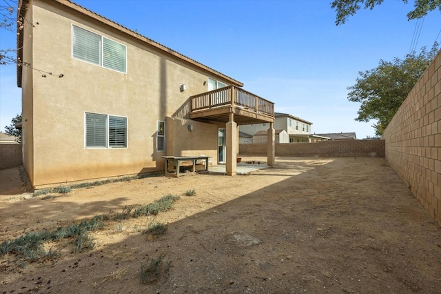 back of house with a patio