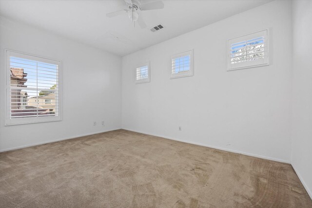 carpeted empty room with ceiling fan