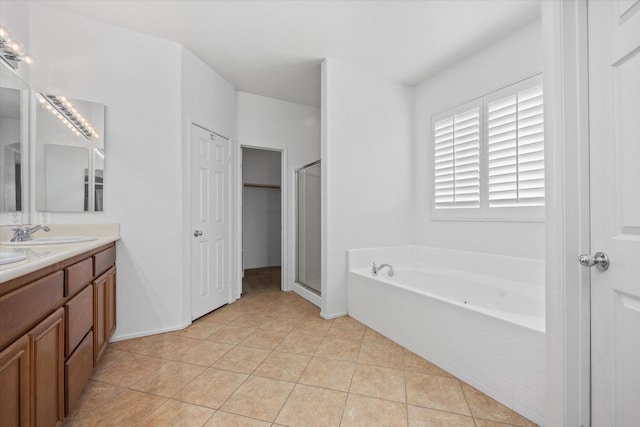 bathroom with vanity, tile patterned floors, and independent shower and bath