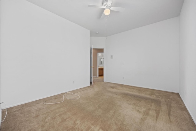 unfurnished room featuring ceiling fan and carpet floors