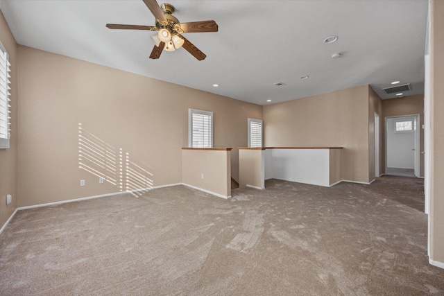 unfurnished room featuring carpet floors and ceiling fan