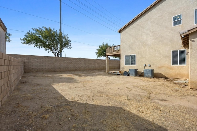 view of yard featuring central air condition unit