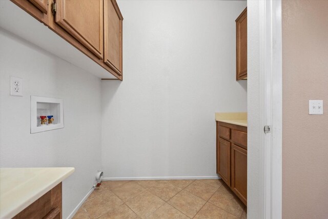 laundry room featuring cabinets and washer hookup