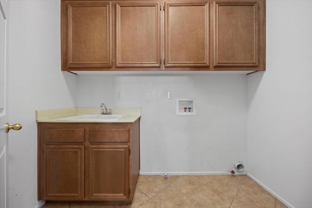 washroom featuring cabinets, hookup for a washing machine, gas dryer hookup, sink, and light tile patterned floors