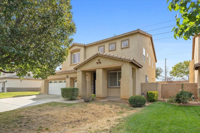 view of front of house featuring a front lawn, fence, concrete driveway, stucco siding, and an attached garage