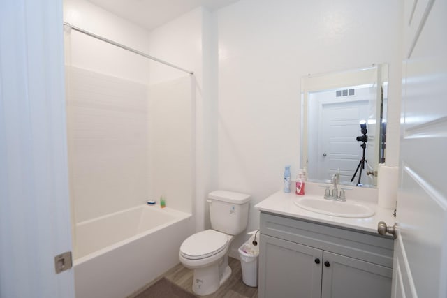 full bathroom featuring vanity, toilet, washtub / shower combination, and wood-type flooring