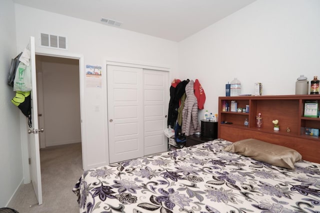 carpeted bedroom featuring a closet