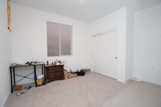 carpeted bedroom with a closet