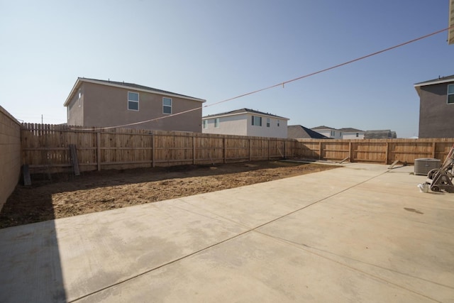 view of yard featuring a patio and central AC unit