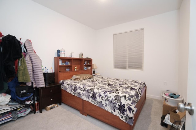 bedroom with light colored carpet