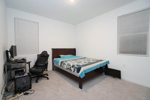 bedroom with light colored carpet