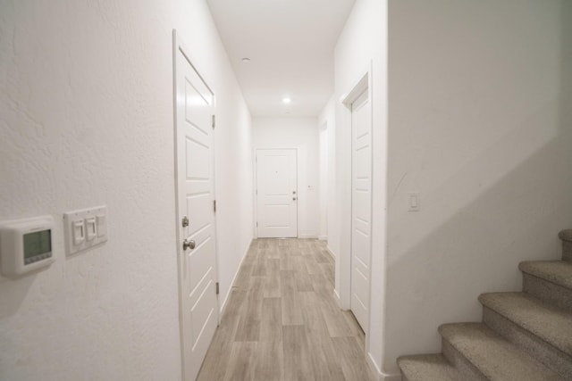 hall with light wood-type flooring