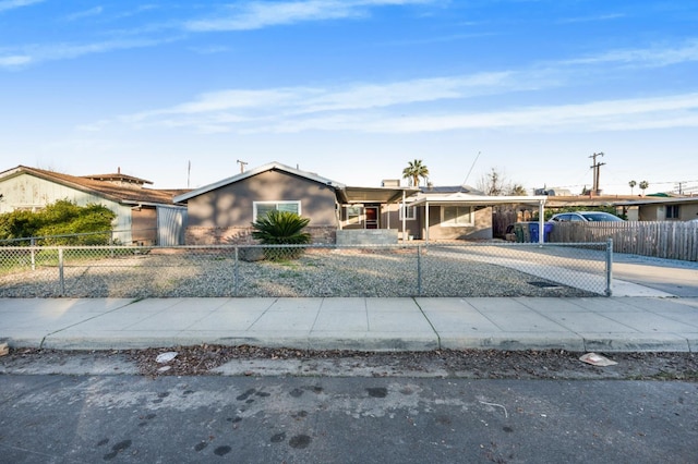 ranch-style home featuring a carport