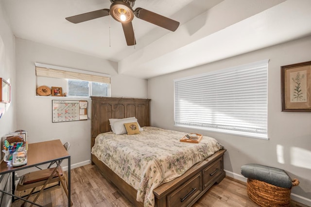 bedroom with ceiling fan and light hardwood / wood-style flooring