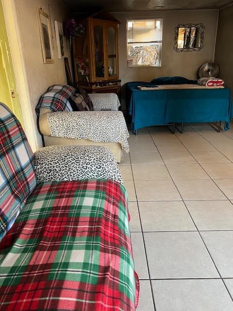 bedroom featuring light tile patterned floors