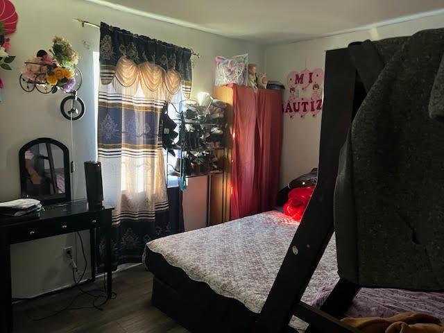 bedroom featuring hardwood / wood-style floors