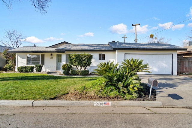 ranch-style house featuring a front yard and a garage