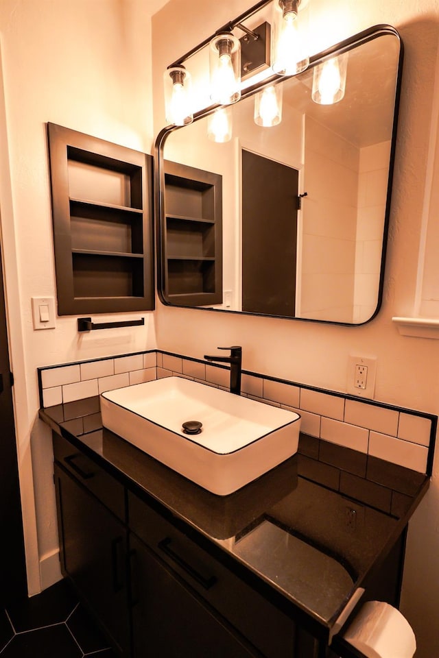 bathroom featuring tile patterned flooring and vanity