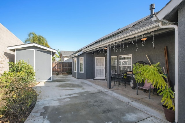 view of patio with a storage shed