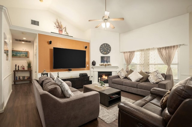 living room featuring vaulted ceiling, ceiling fan, and dark wood-type flooring