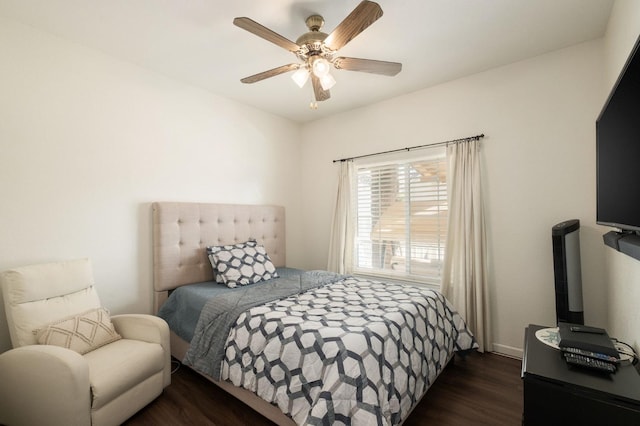 bedroom featuring ceiling fan and dark hardwood / wood-style floors