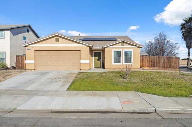 single story home featuring a front lawn, a garage, and solar panels