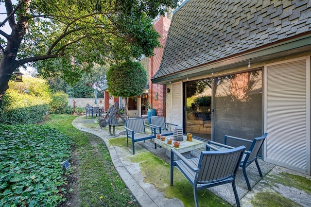 view of patio / terrace featuring fence