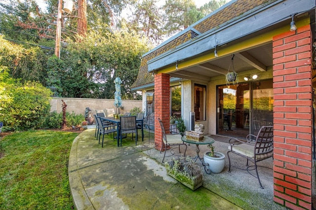 view of patio / terrace with outdoor dining space and fence
