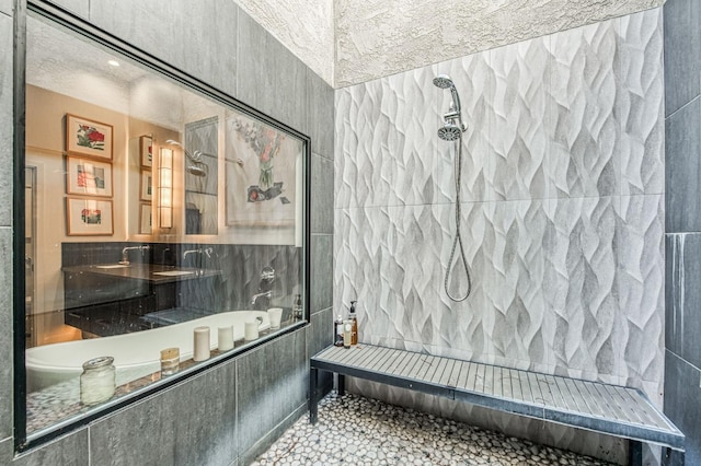 full bath with a tile shower