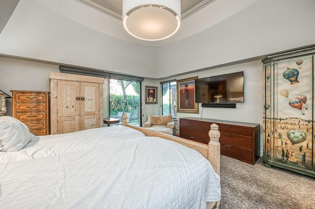 bedroom with crown molding, carpet floors, a high ceiling, and access to outside