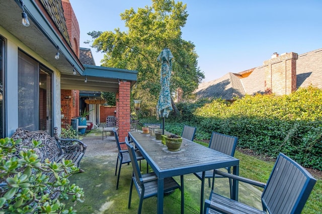 view of patio featuring outdoor dining area