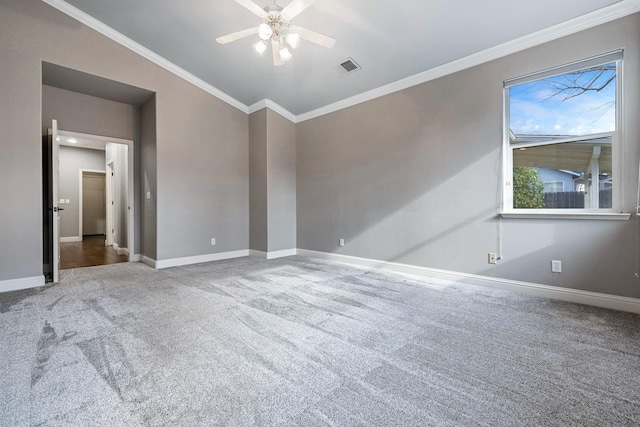 carpeted spare room with vaulted ceiling, ornamental molding, and ceiling fan