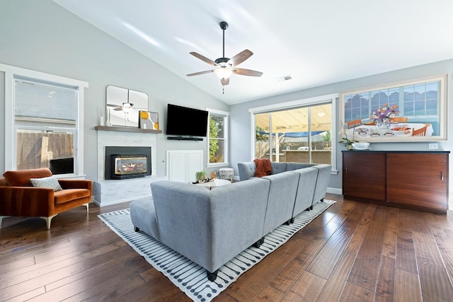 living room featuring dark wood-type flooring, high vaulted ceiling, and ceiling fan