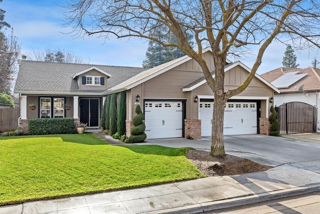 craftsman house with a garage and a front yard