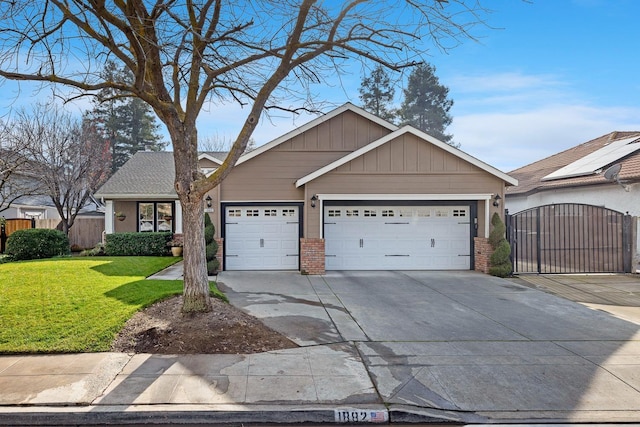 view of front of house with a garage and a front lawn