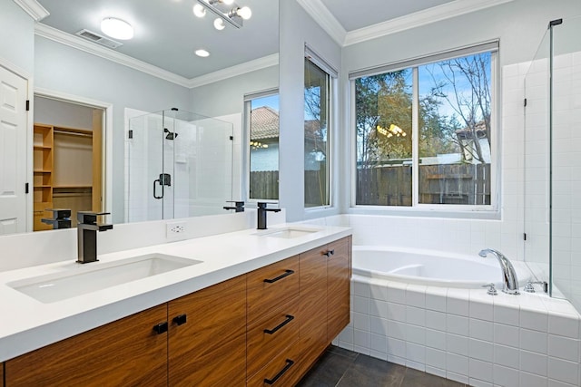 bathroom with vanity, crown molding, tile patterned floors, and independent shower and bath