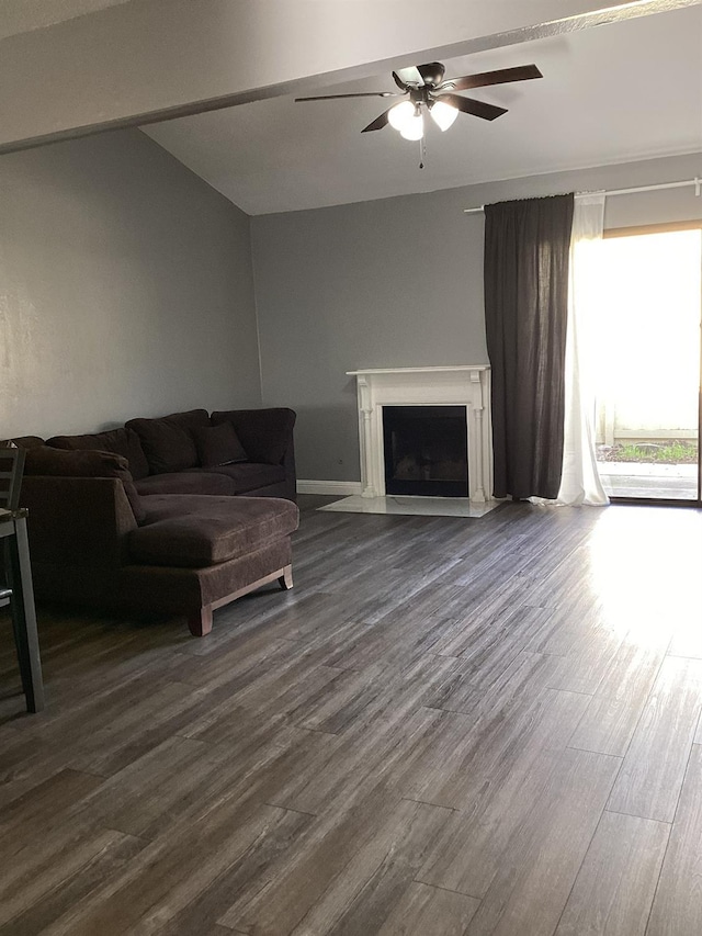 living room with vaulted ceiling, dark wood-type flooring, and ceiling fan