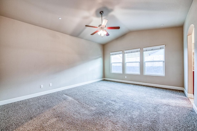 carpeted empty room with lofted ceiling and ceiling fan