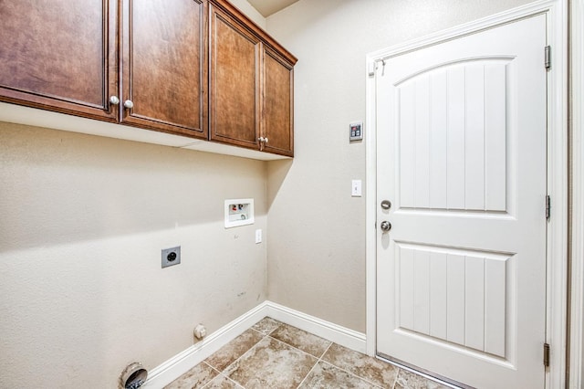 washroom featuring cabinets, hookup for a gas dryer, light tile patterned floors, hookup for a washing machine, and electric dryer hookup