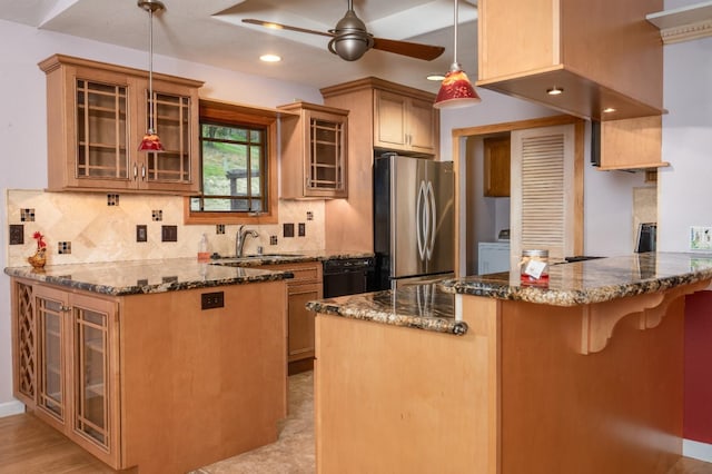 41925 Longhollow Dr, Coarsegold, CA 93614 - kitchen featuring a sink, dark stone countertops, a ceiling fan, a peninsula, and freestanding refrigerator